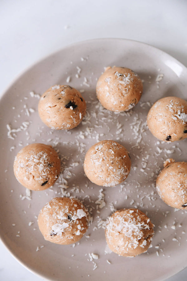 coconut dusted protein bites on a plate