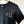 Dark gray tshirt with LBKC logo on left chest.