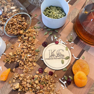 Fall flavored granola scattered on wooden cutting board