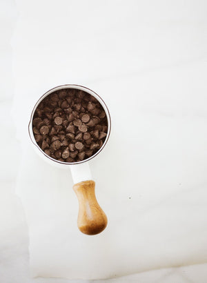 Measuring cup full of chocolate chips